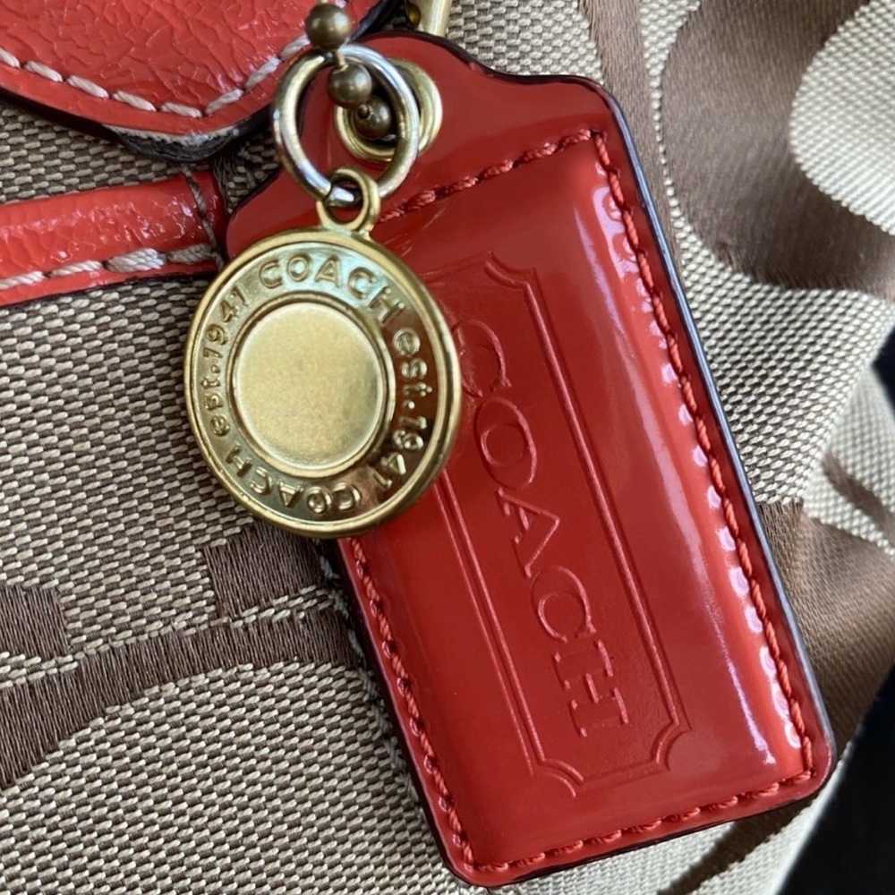 Beautiful, Auth Coach Signat Tote or shoulder bag in a really soft,coral color.
